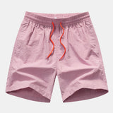 Hemd mit Palmenmuster und Shorts zum Schwimmen